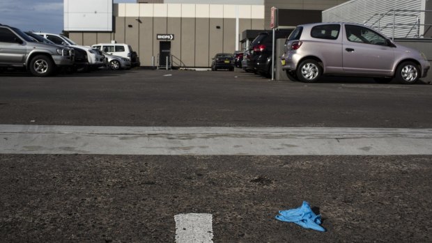 A discarded glove lay on the rooftop carpark on Saturday.