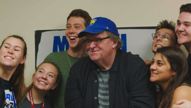 The young think differently, says Michael Moore, pictured with anti-gun activists in Fahrenheit 11/9.