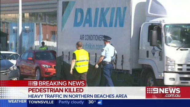 A female pedestrian has been killed after being hit and dragged along the street by a truck on Sydney's northern beaches.