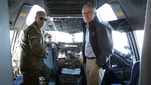 Chief of the Defence Force Air Chief Marshal Mark Binskin and Prime Minister Malcolm Turnbull in discussion on the flight deck of a C-17 Globemaster during their flight to Iraq.