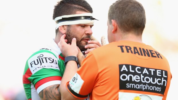 Adam Reynolds gets attention for a jaw injury suffered in the Rabbitohs clash with the Roosters on Sunday.