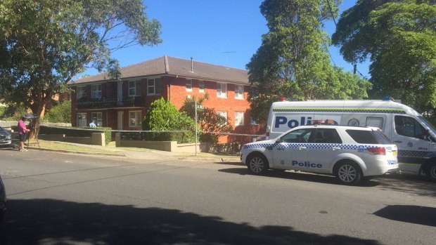 The body of a woman was found at the rear of the property about 1.15pm. 