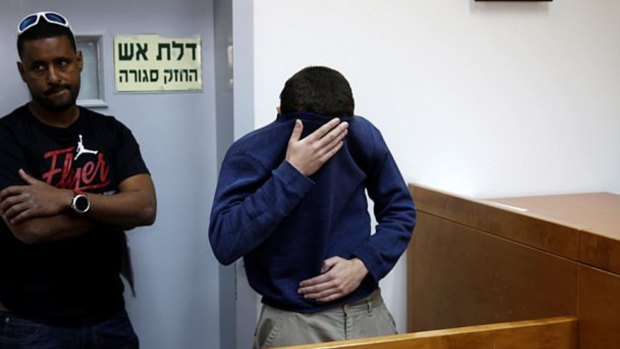 Michael Ron David Kadar, pictured in an Israeli court, was arrested after allegedly threatening schools, airlines, hospitals and Jewish centres in the US, Britain, Australia, New Zealand and Israel.