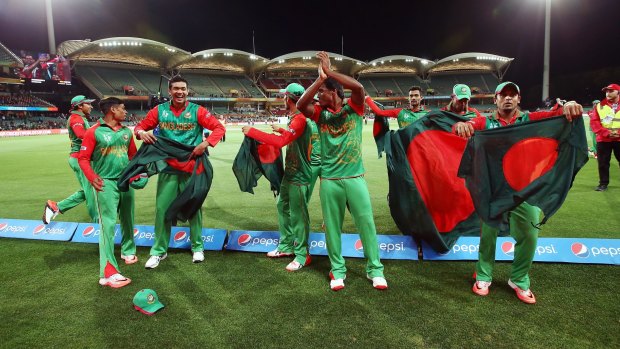 Bangladesh players celebrate after defeating England.