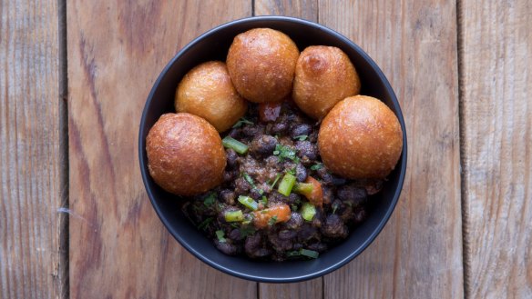 Black beans with puff puff.