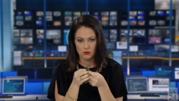 Exelby holds her pen as she begins to realise she is on air.