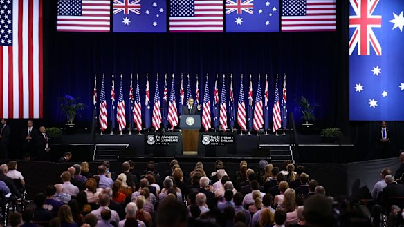 Waving the flags: The audience repeatedly applauded President Obama. 
