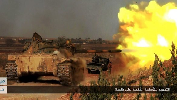An image posted on the Twitter page of Syrian jihadists shows a rebel tank firing at Syrian troops at Khalsa village, southern Aleppo.