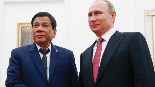 Russian President Vladimir Putin, right, shakes hands with Philippine President Rodrigo Duterte during their meeting at the Kremlin in Moscow on Tuesday.