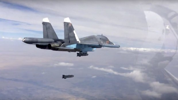 A bomb is released from a Russian Su-34 strike fighter in Syria in a video posted on Friday. 