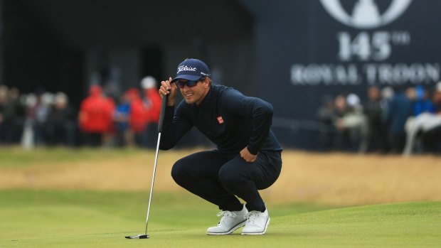 Taking aim: Adam Scott lines up a putt on the first green during the third round of the 145th Open Championship at Royal Troon.