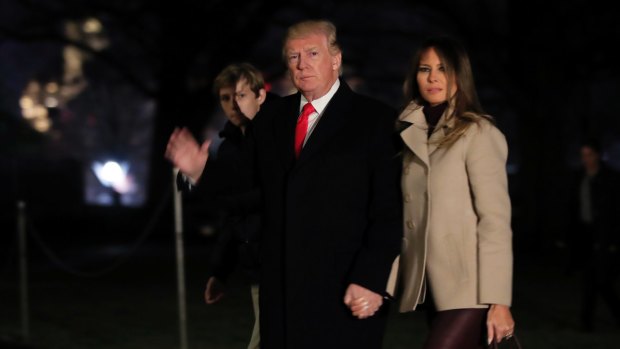 US President Donald Trump, with first lady Melania Trump and their son Barron Trump, returns to the White House on January 1.