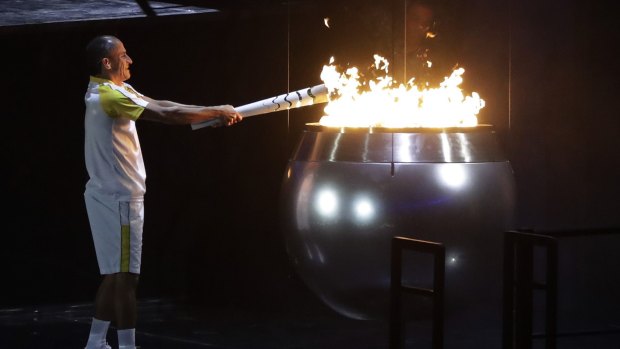Vanderlei de Lima lights the Olympic flame during the 2016 opening ceremony in Rio.