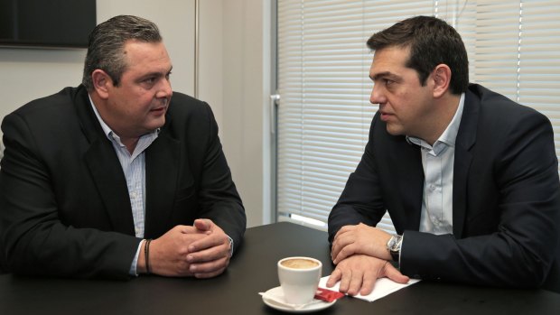 Syriza leader Alexis Tsipras (right) meets with Panos Kammenos, chairman of Independent Greeks party.