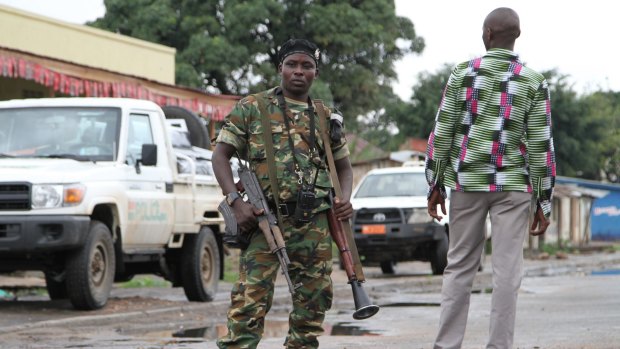 A Burundian soldier guards a deserted street in Bujumbura, Burundi.