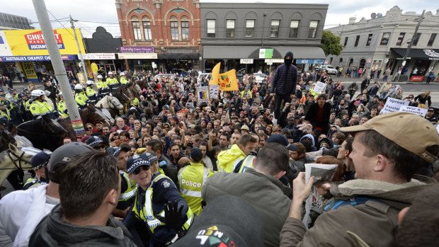 Protest between UAP and campaigners against racism and fascism erupts at Richmond Town Hall. 