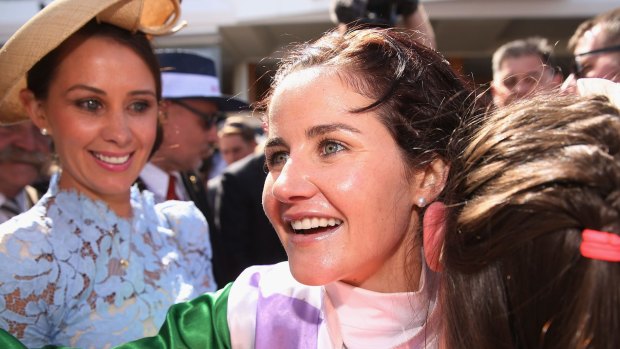 Jockey Michelle Payne and her sisters celebrate her 2015 Melbourne Cup winning ride on Prince Of Penzance.