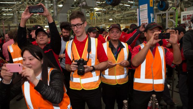 Toyota employees mark the occasion of the launch of the new Camry, the last car to be made in Australia at the Altona Factory. 