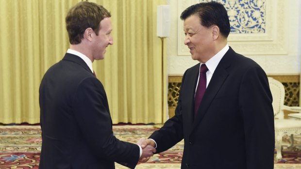 Politburo Standing Committee member Liu Yunshan, right, meets Facebook founder and CEO Mark Zuckerberg in Beijing on Thursday.