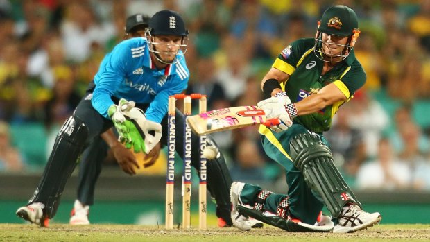 Bullish form: David Warner plays a sweep shot to bring up his century during the One Day International series match against England at the SCG on January 16.