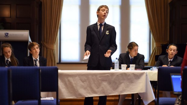 Norfolk student Harrison Hayes speaks at the Premier's Debating Challenge State Championships at Sydney University.