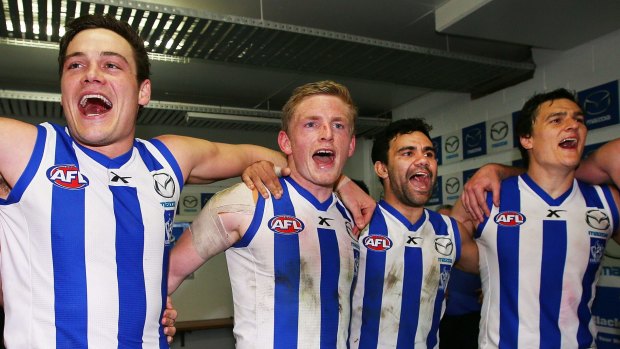 Nathan Grima (left) in celebratory mode during his North Melbourne days.