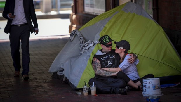 Homeless couple Josh and Tara near the corner of Flinders and Market Street.