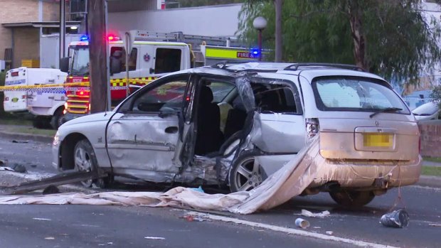 The wreck of the Holden Commodore on Waldron Road in Chester Hill after a fatal crash in which a woman, sitting on the rear passenger side, was killed.
