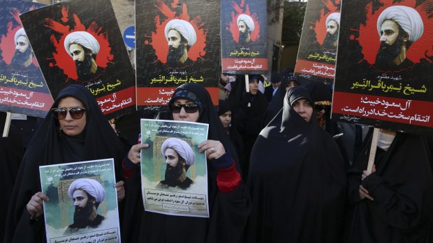 Iranian demonstrators hold posters of Sheikh Nimr al-Nimr in Tehran.