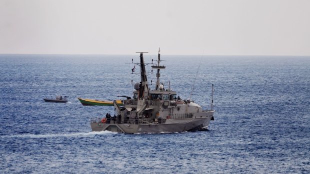 An Australian Navy vessel approaches a suspected refugee boat off the coast of Christmas Island in November.
