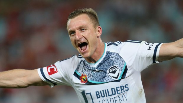Melbourne Victory's Besart Berisha celebrates scoring one of three goals during the match between Western Sydney Wanderers and Victory at ANZ Stadium in Sydney.