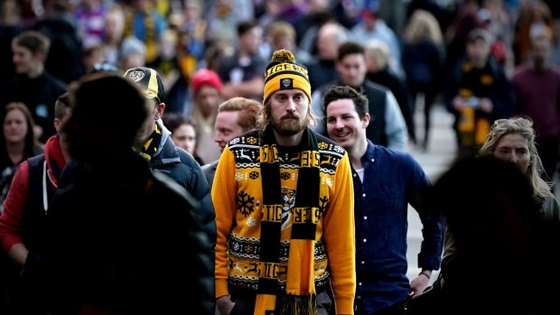 Disappointed Richmond supporters leave Etihad Stadium after their VFL loss against Port Melbourne.