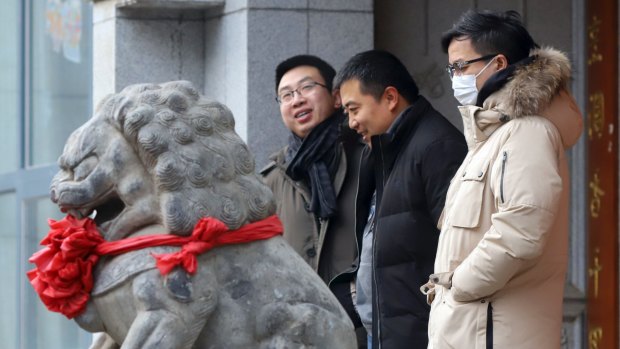 A man wears a mask against pollution during a hazy day in Beijing, China, in December.