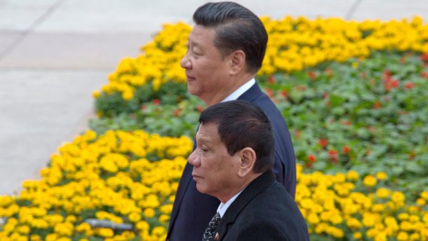 Philippine President Rodrigo Duterte (front) and China's Xi Jinping outside the Great Hall of the People in Beijing.