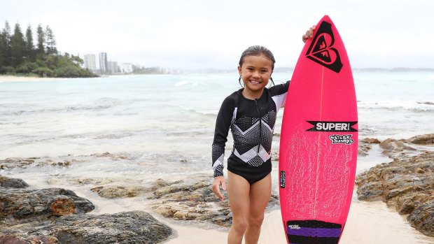 Sky Brown, eight years old from Japan, poses at Snapper Rocks.