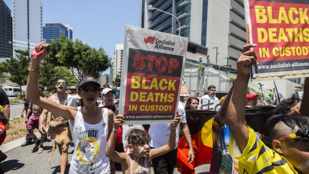 Demonstrators protest deaths in custody outside the G20 Summit in Brisbane.