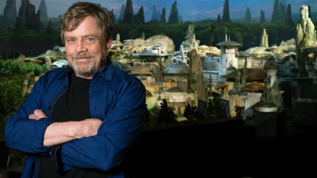Mark Hamill at the D23 Expo in front of a model of the new Star Wars-themed land at Disneyland Resort in California and Walt Disney World Resort in Florida. It opens in 2019.