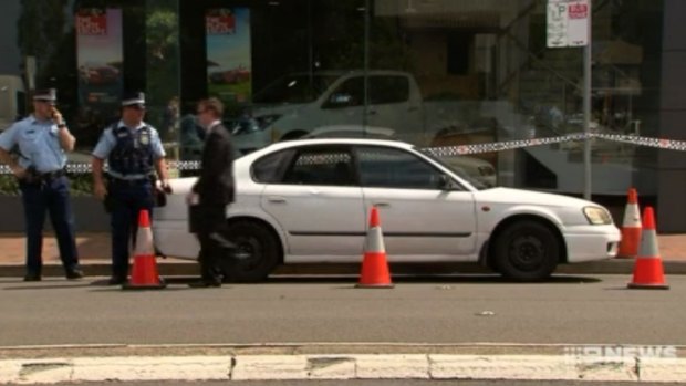 Police allege the man smashed a car's window with his axe.