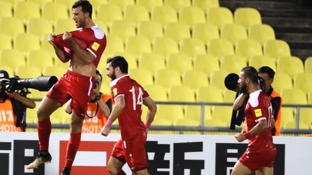 Controversial: Firas Mohamad Alkhatib celebrates after scoring equaliser.
