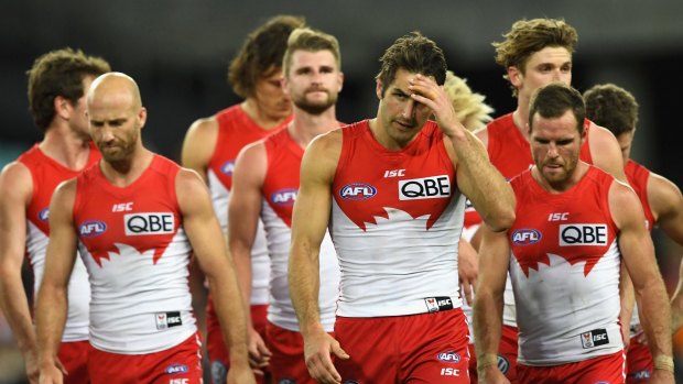 The Swans walk off after losing to the Giants.