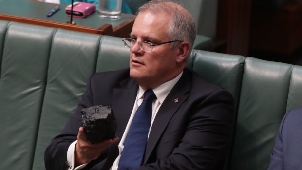 Treasurer Scott Morrison brandishing a lump of coal in Parliament.