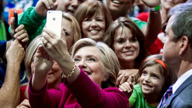 Hillary Clinton with supporters at a campaign rally.