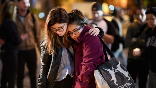 Members of the public at a vigil for the victims of the terror attack at the Ariana Grande concert in Manchester. The victims were primarily girls and women.