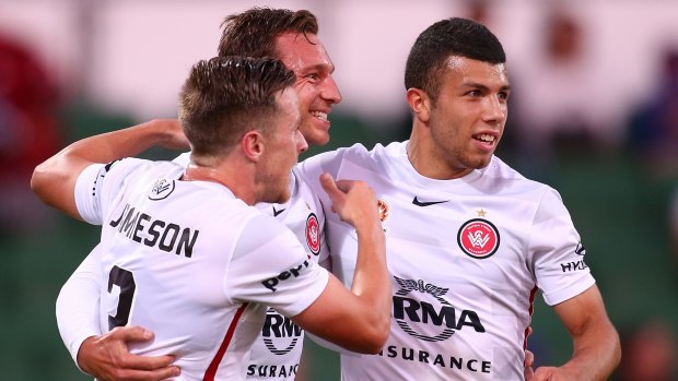 Perfection: Brendon Santalab feels the love after scoring the Wanderers' opener.
