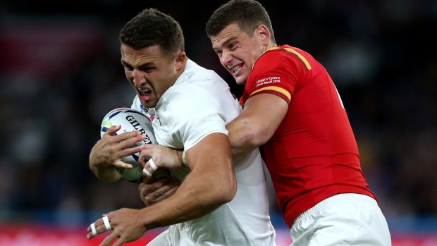 Hard-running: Because of his size, Sam Burgess attracts plenty of defenders. 
