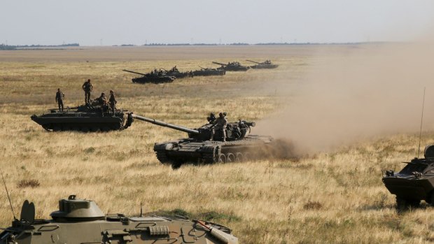 Ukrainian tanks and APCs move towards the de-facto border with Crimea near Kherson, southern Ukraine in August.
