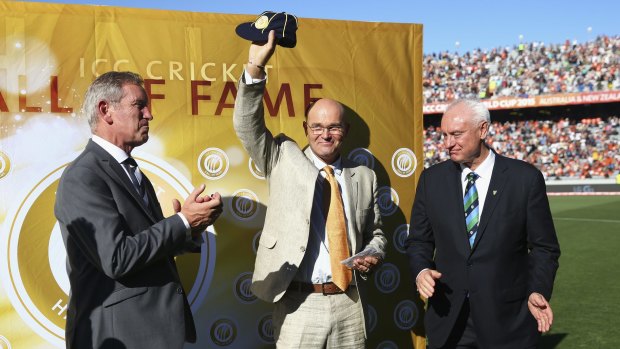 Their hero: Martin Crowe waves to the masses at Eden Park.