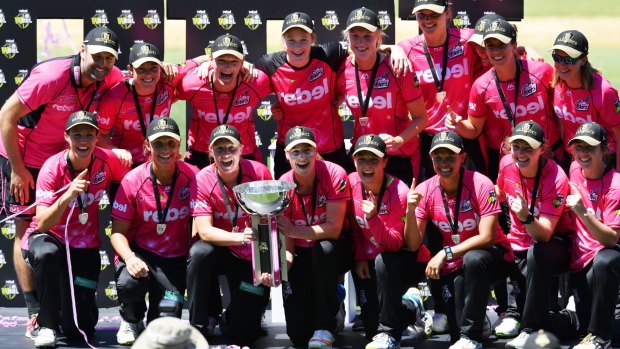 Podium finish: The Sydney Sixers with the WBBL trophy. 