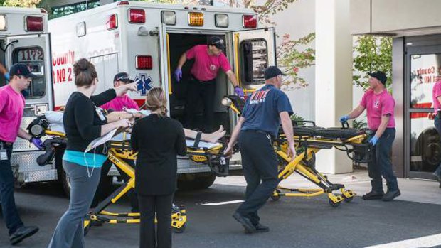 A patient is wheeled into the emergency room at Mercy Medical Centre in Roseburg, Oregon, following a deadly shooting at Umpqua Community College, in Roseburg on Thursday