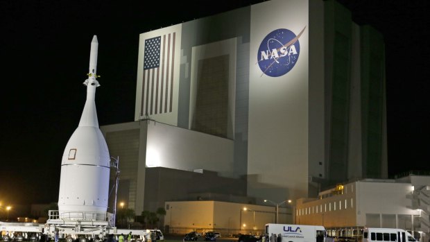 Great expectations: The Orion spacecraft moves by the Vehicle Assembly Building on its journey to Space Launch Complex 37B at the Cape Canaveral Air Force Station in Florida.